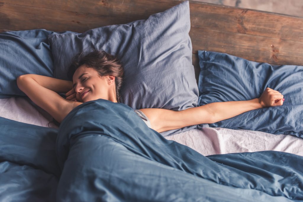 Young woman in bed